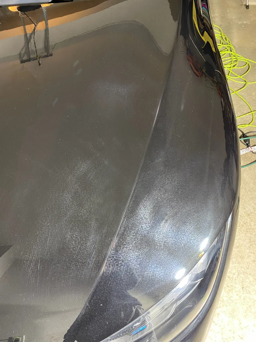 Before: swirls and haze on a dark gray hood