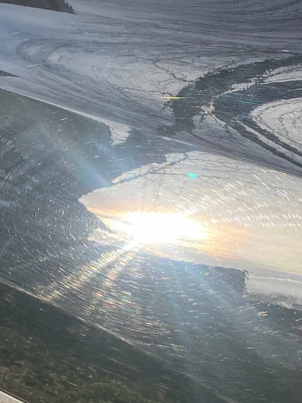 Spiderweb swirls in direct sunlight